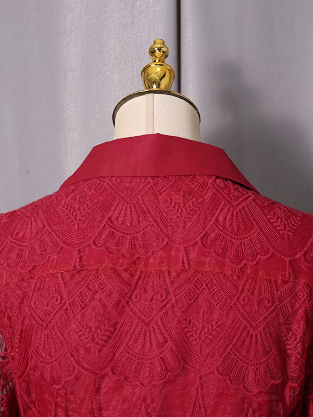 Red lace midi dress with collared neckline and button placket detail.