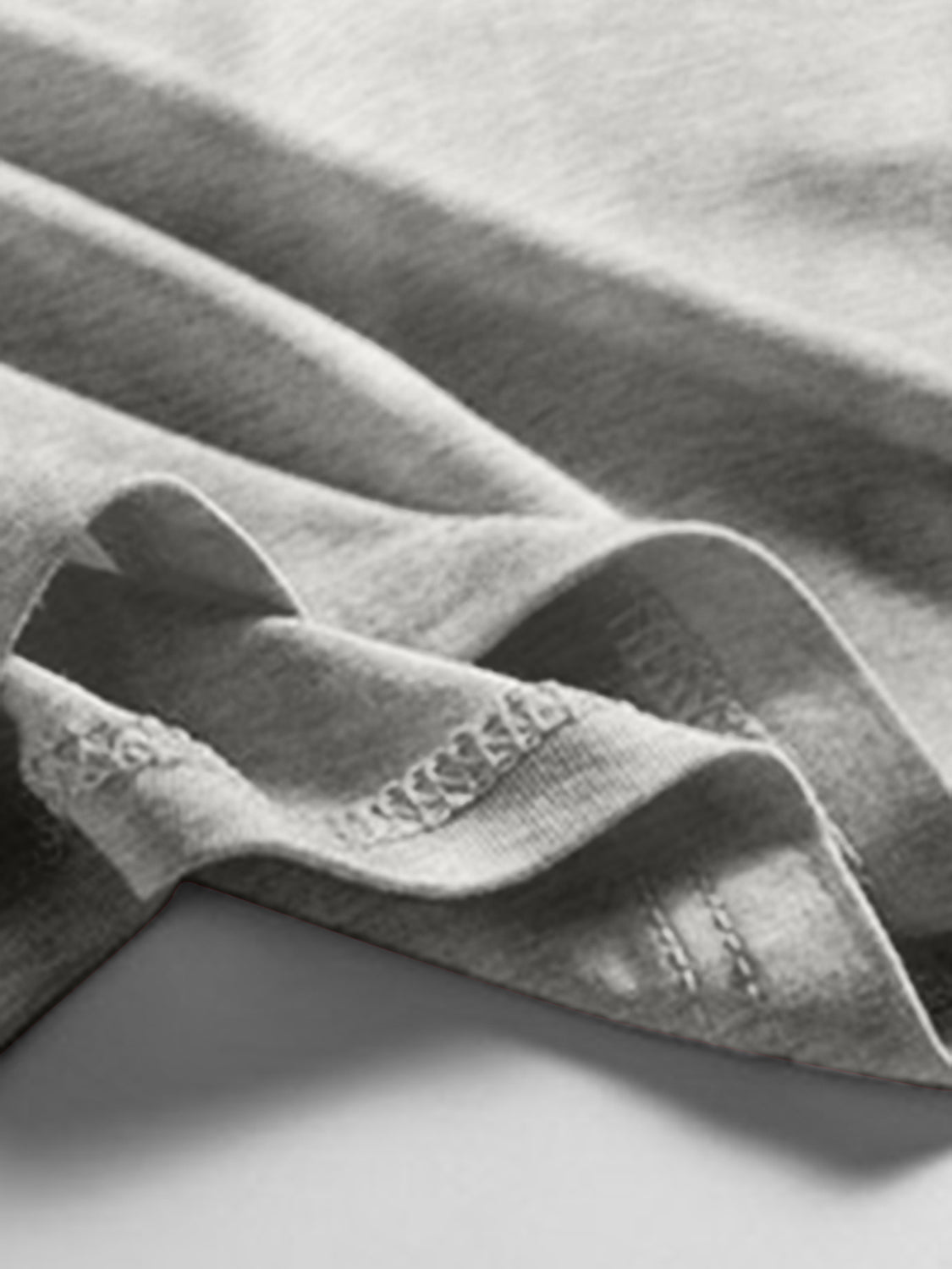 Gray scoop neck tank top with visible stitching detail