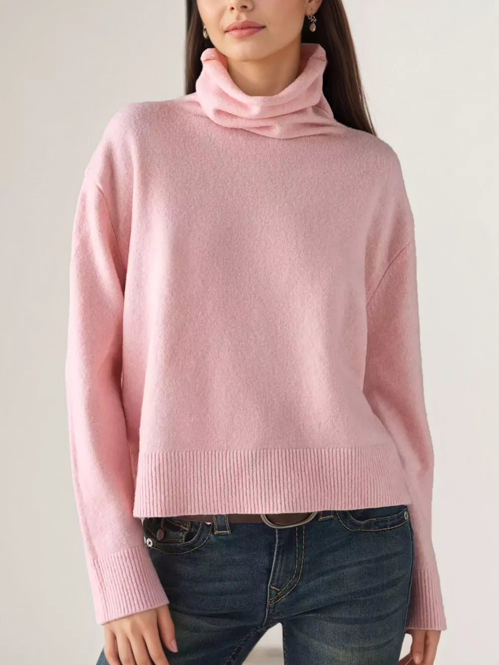 turtleneck sweater in blush pink featuring ribbed hem and relaxed fit