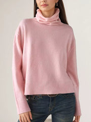 turtleneck sweater in blush pink featuring ribbed hem and relaxed fit