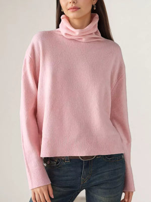 turtleneck sweater in blush pink featuring ribbed hem and relaxed fit