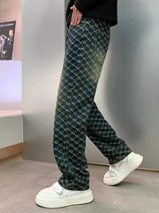 Relaxed fit men's jeans in dark wash denim with all-over woven motif pattern.