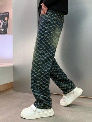 Relaxed fit men's jeans in dark wash denim with all-over woven motif pattern.