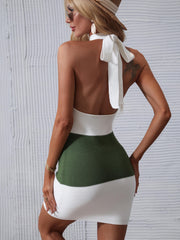 Colorblock halter knit mini dress with bow detail and green and white stripes.