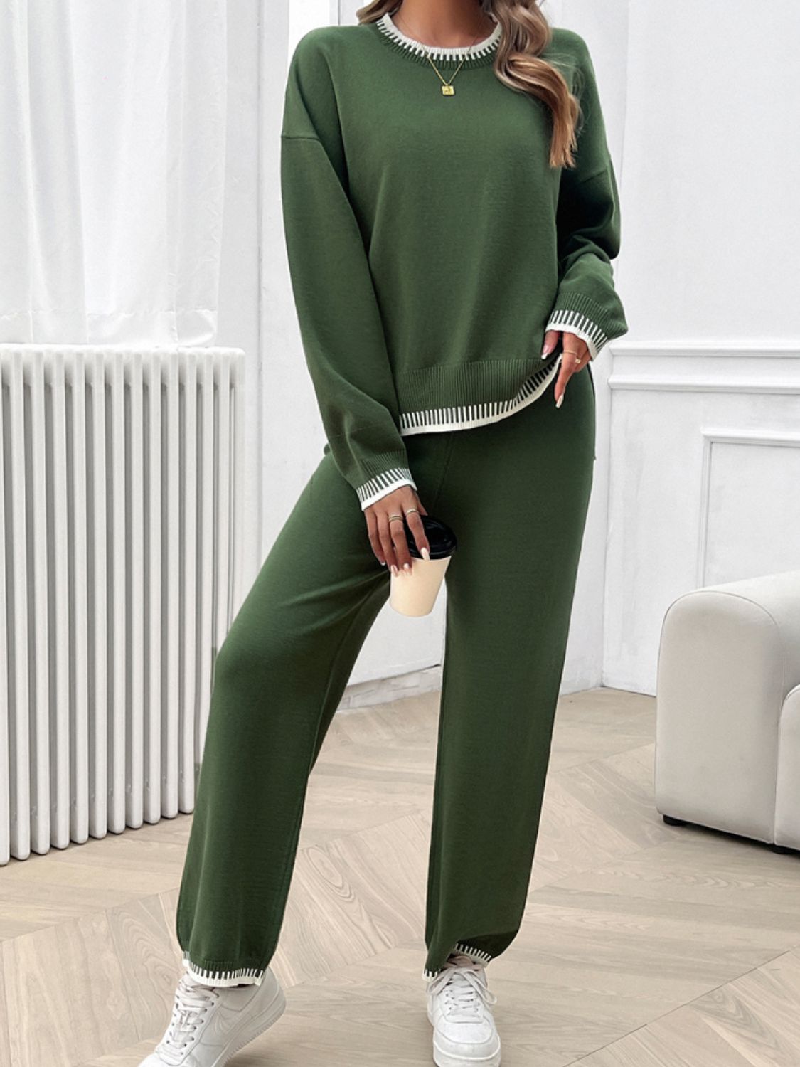 Army green knit lounge set with white ribbed trim on crewneck, cuffs, and hem.