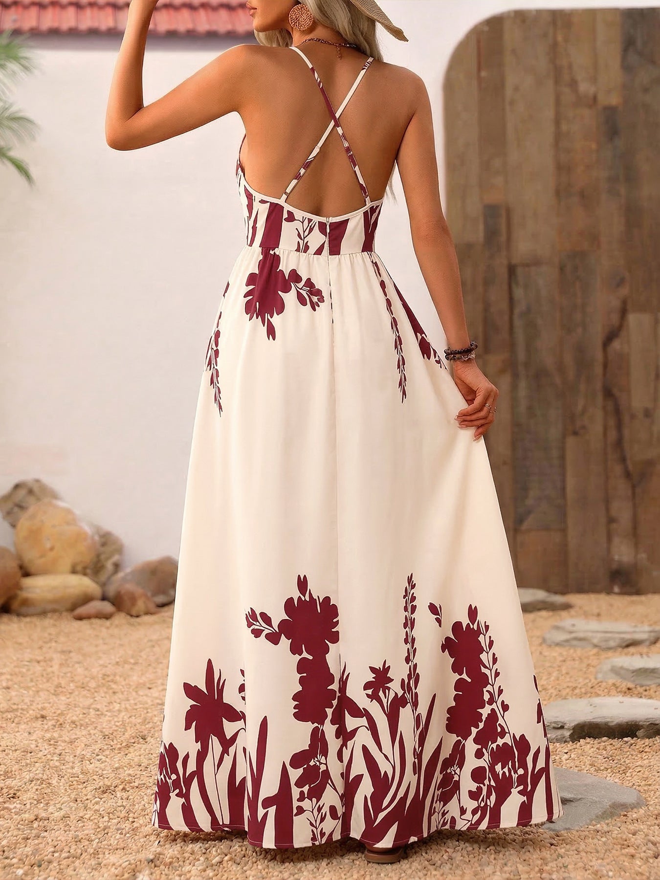 Floral maxi dress with deep V-neck and criss-cross straps, a-line cut, cream with burgundy floral print.
