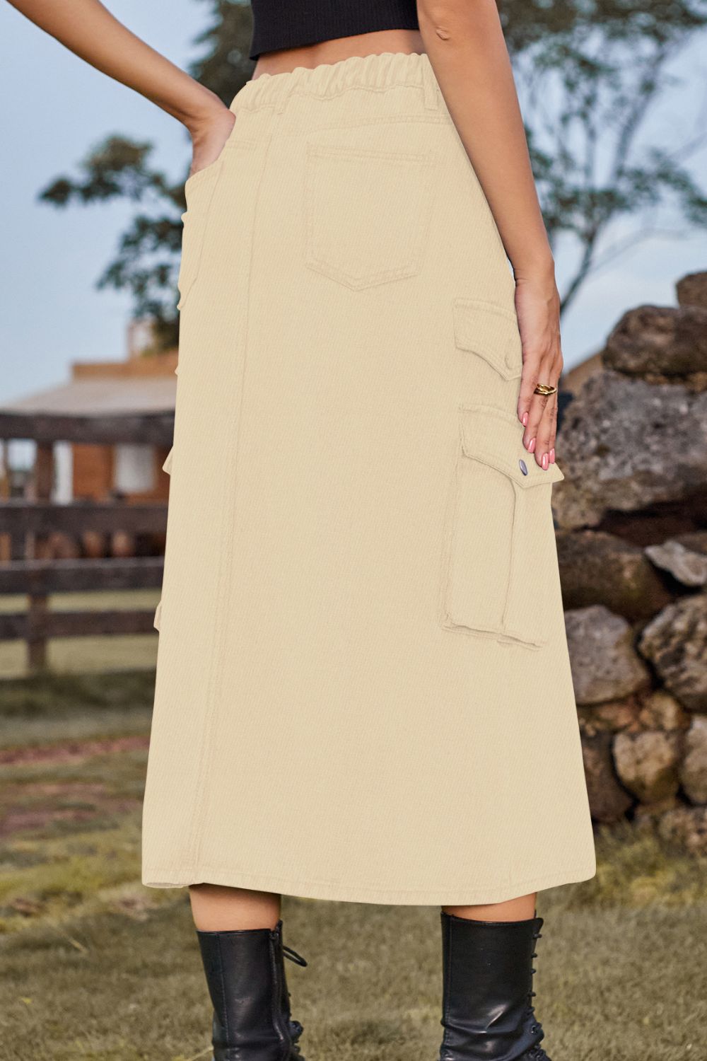 Tan denim midi skirt with cargo pockets and a slit, elastic waist