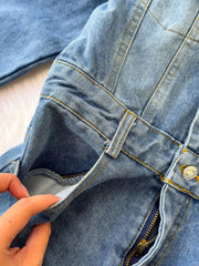 Chic buttoned denim jumpsuit with pockets and zipper detail