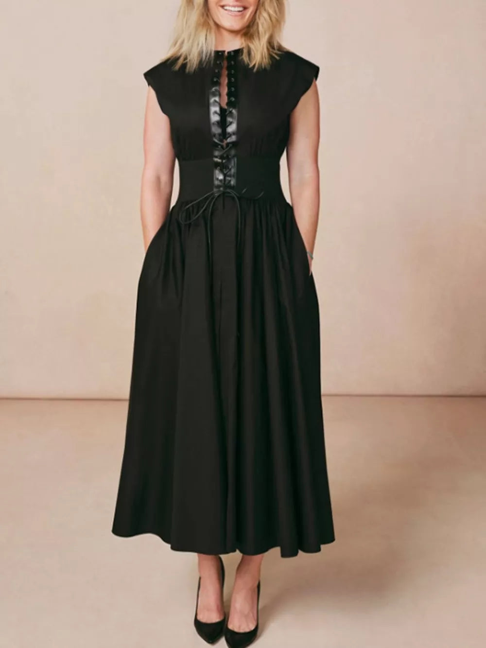 Black lace-up midi dress with cap sleeves, cinched waist, and pockets.