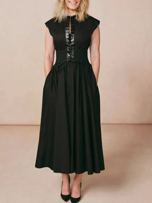 Black lace-up midi dress with cap sleeves, cinched waist, and pockets.