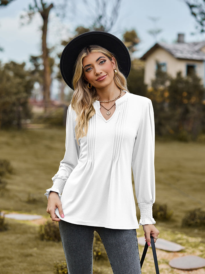 White long sleeve blouse with pleated yoke and shirred cuffs