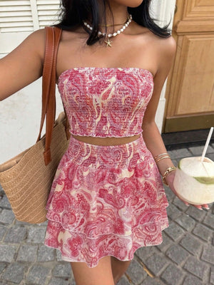 Paisley print smocked two-piece set with a strapless crop top and tiered frill skirt.