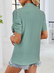 Sage eyelet ruched short sleeve blouse with a collared neckline.