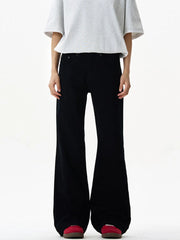 Black wide-leg sweatpants with a relaxed fit and flared hem, styled with a grey t-shirt.