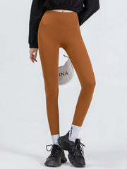 Caramel high-waist leggings with a seamless contour design.