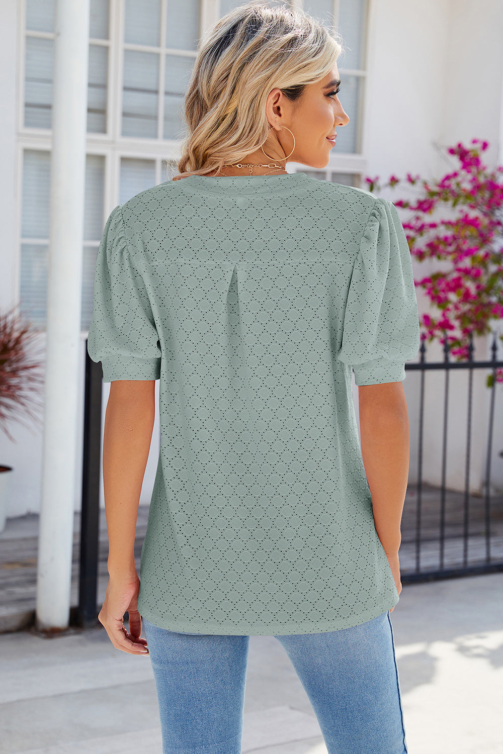 Light Green eyelet V-neck blouse with puff sleeves and a textured pattern.