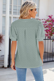 Light Green eyelet V-neck blouse with puff sleeves and a textured pattern.