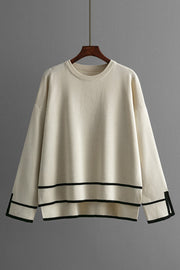 Cream acrylic round neck sweater with black stripe detail on hem and cuffs