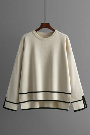 Cream acrylic round neck sweater with black stripe detail on hem and cuffs
