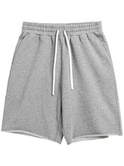Gray relaxed fit jogger shorts with raw hem and white drawstring waist