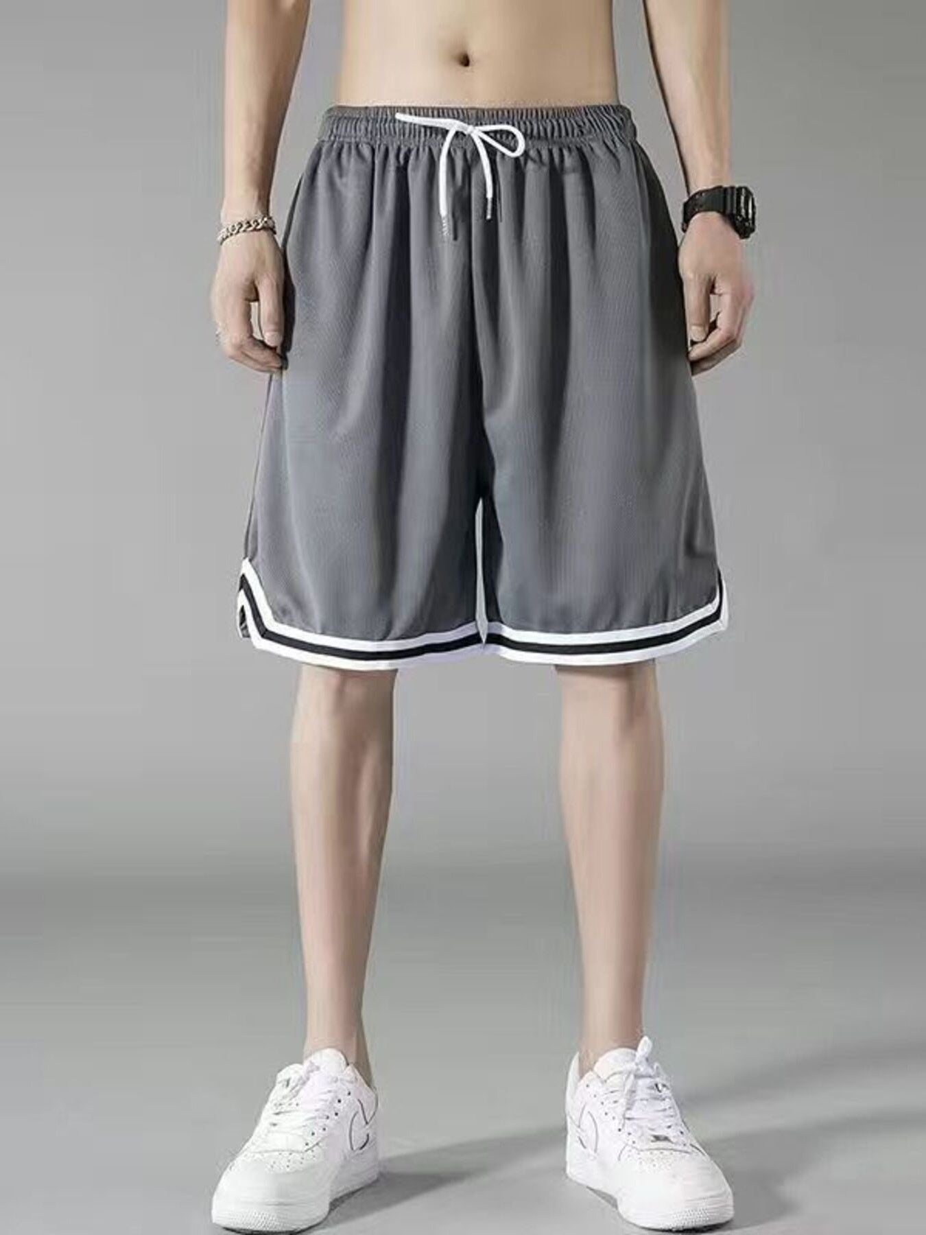 Men's dark gray athletic shorts with white drawstring and striped trim