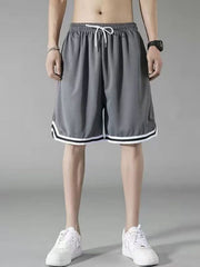 Men's dark gray athletic shorts with white drawstring and striped trim