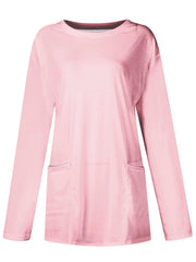 Relaxed fit blush pink tunic with long sleeves and two patch pockets.