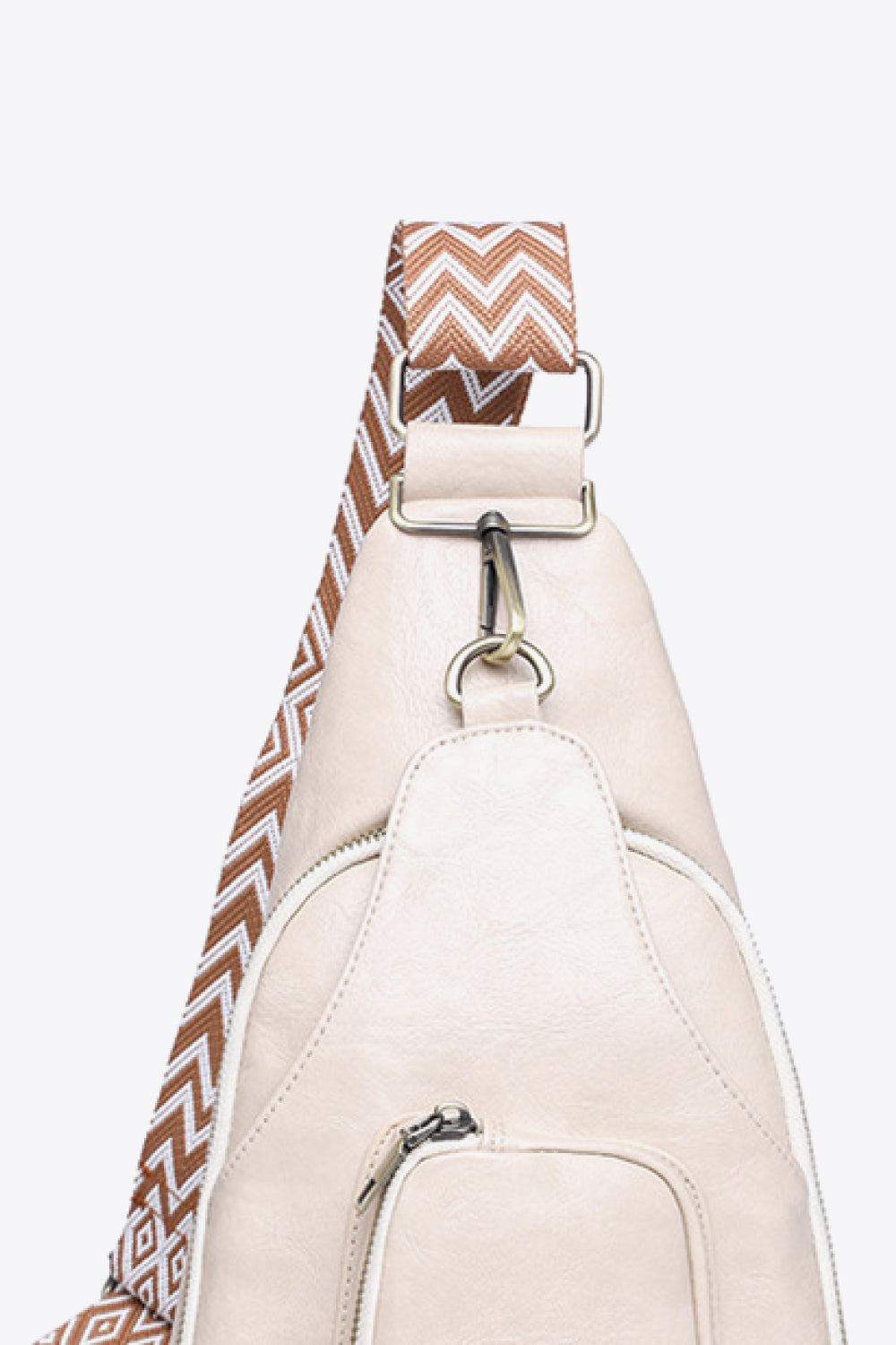 Ivory PU sling bag with chevron strap and silver hardware detail