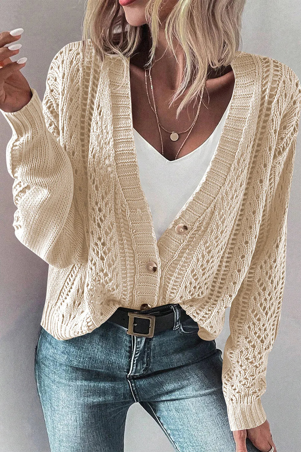 Taupe knit cardigan with mesh detail and button front, styled with a white tank and jeans.