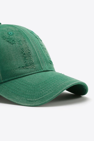 Green distressed baseball cap with frayed details and stitched brim.