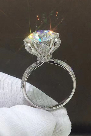 Sparkling Aura Moissanite Ring in silver with a large center stone and diamond-accented band.