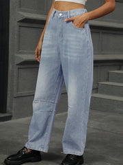 Relaxed light wash denim trousers with patchwork detail and wide leg.