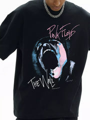 Black cotton oversized t-shirt with Pink Floyd The Wall graphic print.