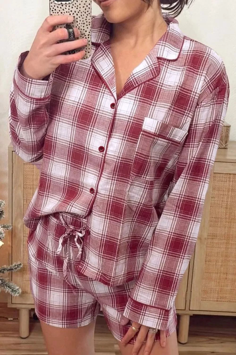 Cozy red plaid cotton pajama set with pocketed button-up top and drawstring shorts.