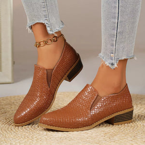 Tan woven texture pointed loafers with block heels and elastic side panels.