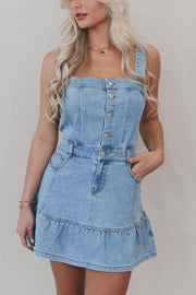 Button-front denim sundress with ruffle hem and square neckline in medium wash.