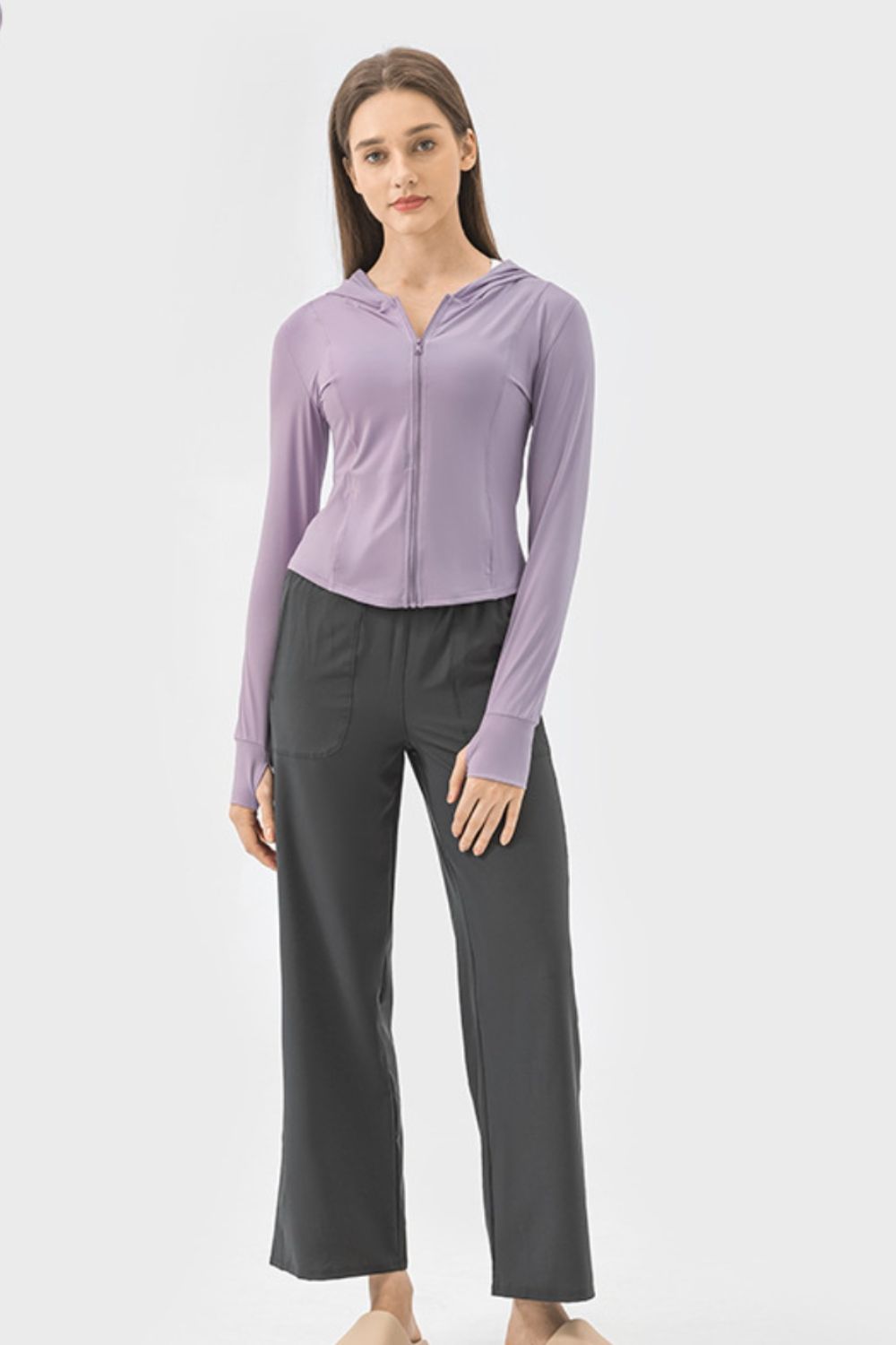 Lavender active hoodie with zipper and thumbholes worn by a model.