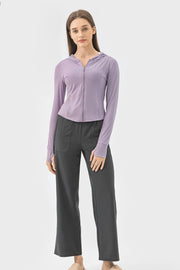 Lavender active hoodie with zipper and thumbholes worn by a model.