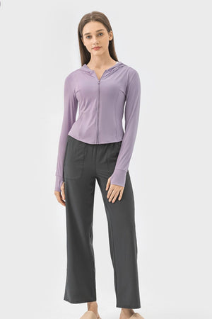 Lavender active hoodie with zipper and thumbholes worn by a model.