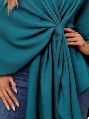 Tie-front knit cape top in French Blue with draped elegance detail.