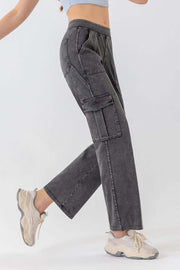 Gray denim cargo pants with utility pockets and a relaxed fit.
