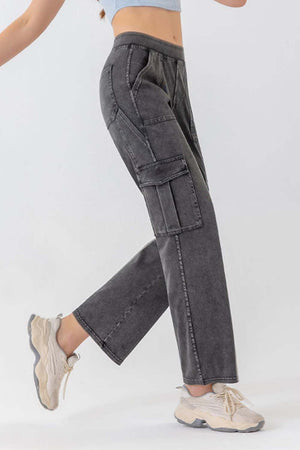 Gray denim cargo pants with utility pockets and a relaxed fit.