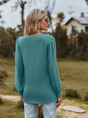 Teal Swiss dot sleeve V-neck top with a casual fit.