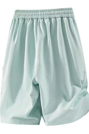 Relaxed fit sage chino shorts with drawstring waist and pockets.