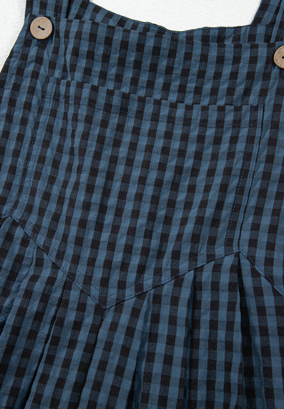 Textured dark blue gingham overalls with button detail and pocket