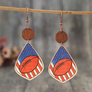 Patriotic football woodcut dangle earrings with American flag design.
