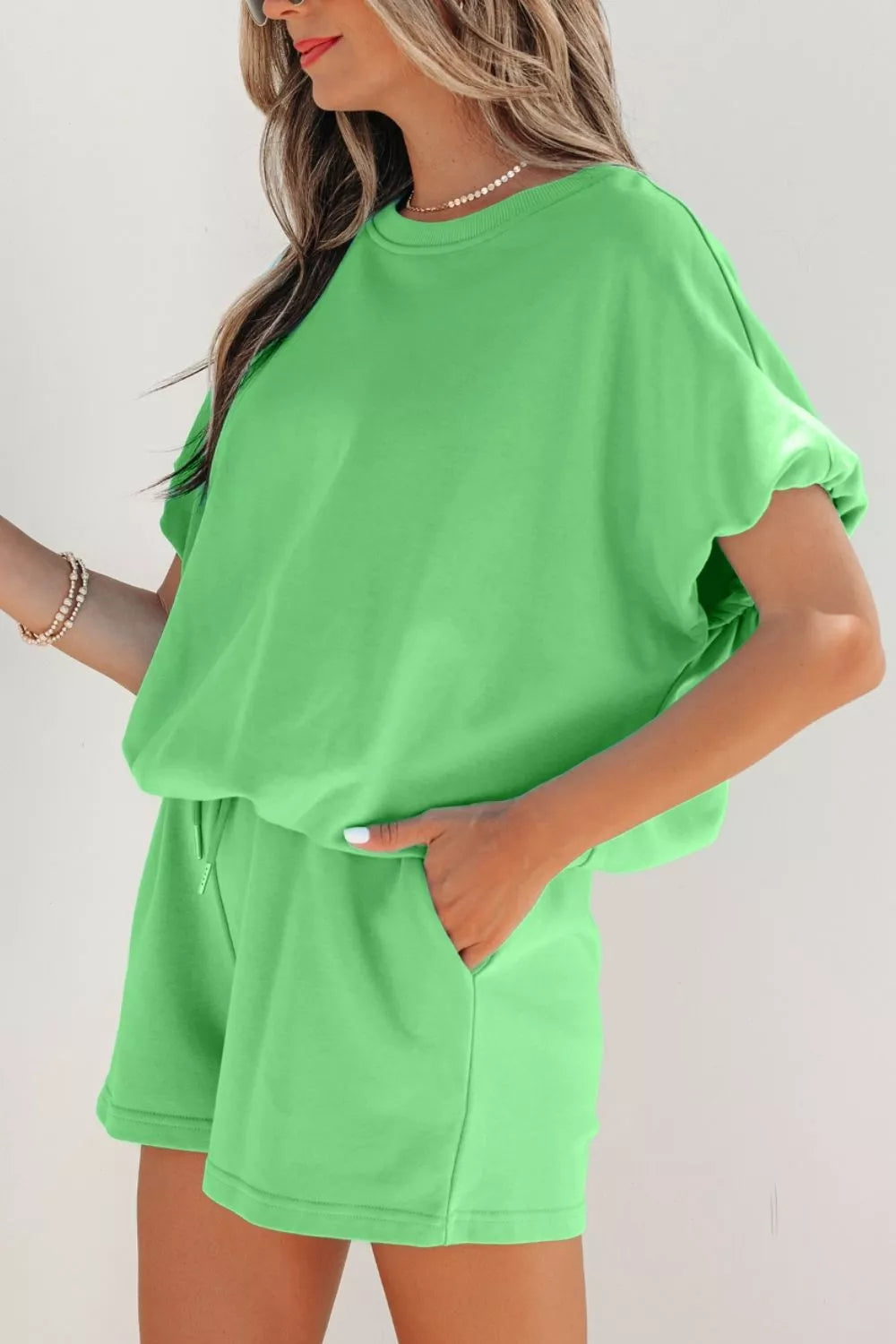 Lime green cotton drawstring two-piece outfit set with crew neck top and shorts.