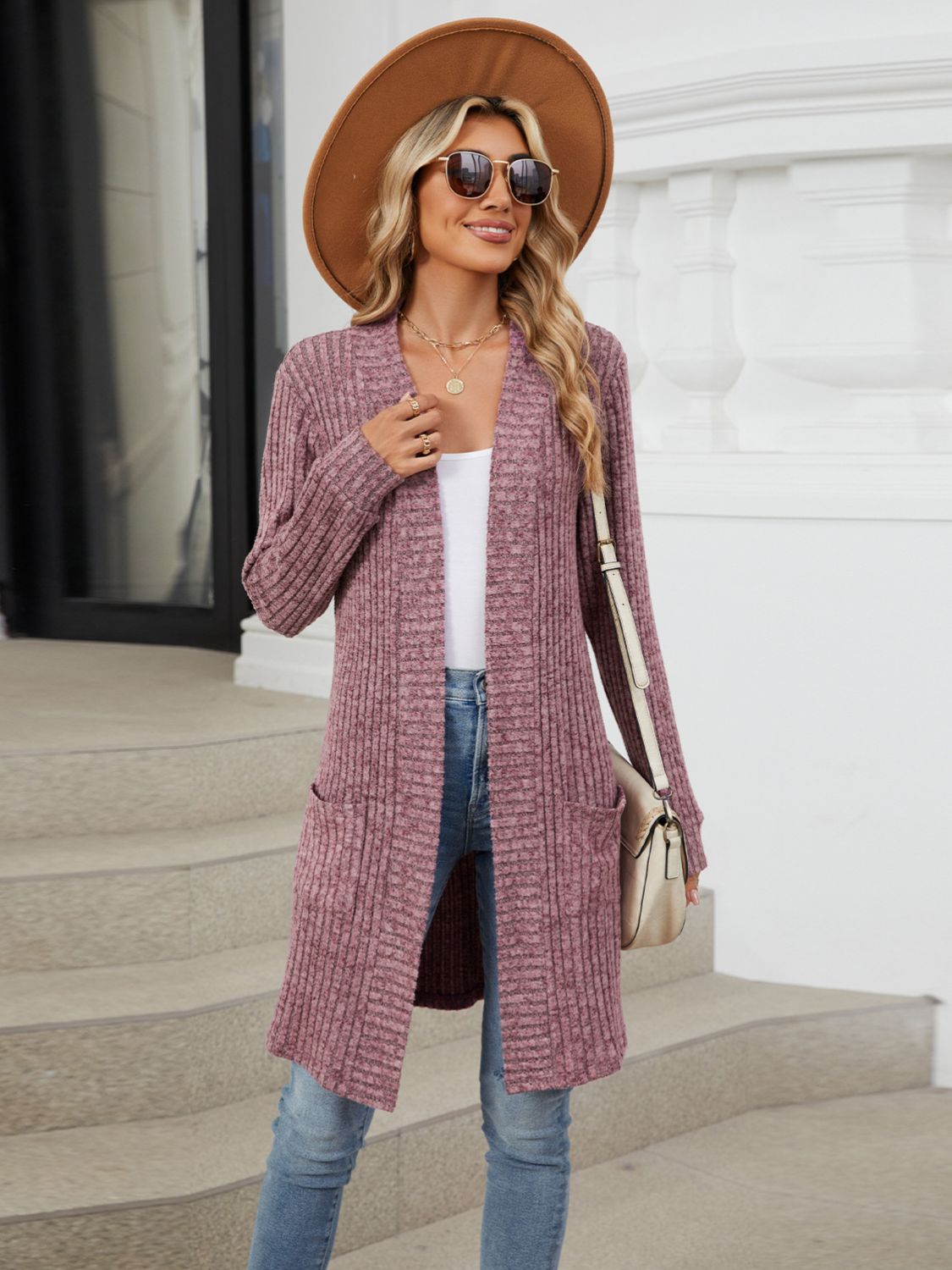 Textured ribbed knit duster cardigan in dusty rose with open front and pockets.