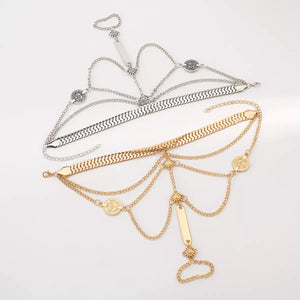 Gold and silver multi-layered chain bracelets with coin and bar charms