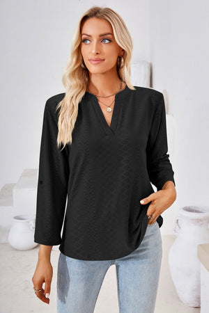Black textured henley blouse with v-neck and rolled sleeves